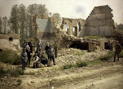 French soldiers and actors of the front theatre pose in the ruins, Vauxrezis, Aisne, France, 1917 by Fernand Cuville